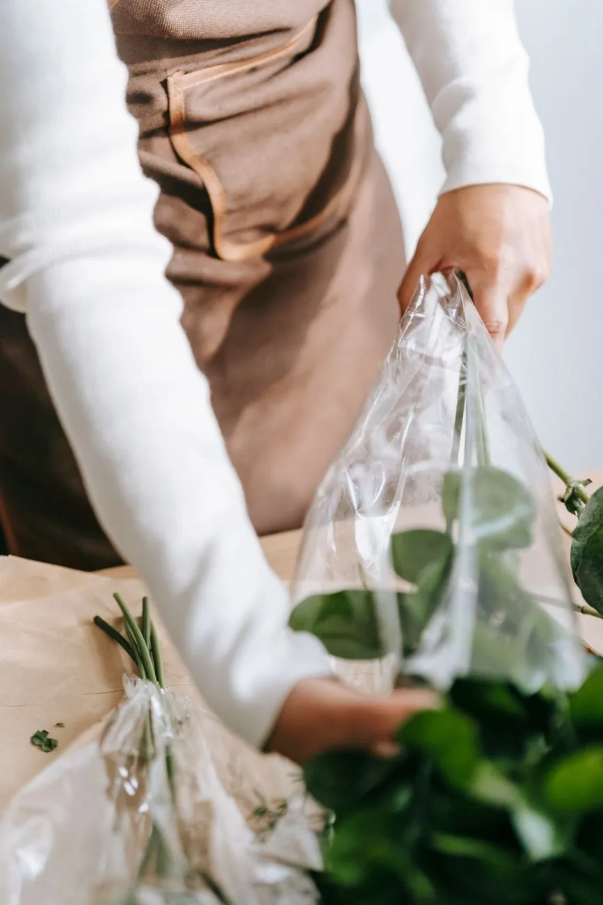 A bouquet being wrapped for delivery